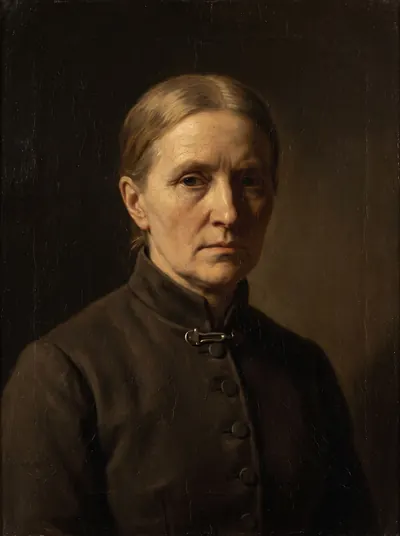 Portrait of a sharp-featured woman in a buttoned official coat.